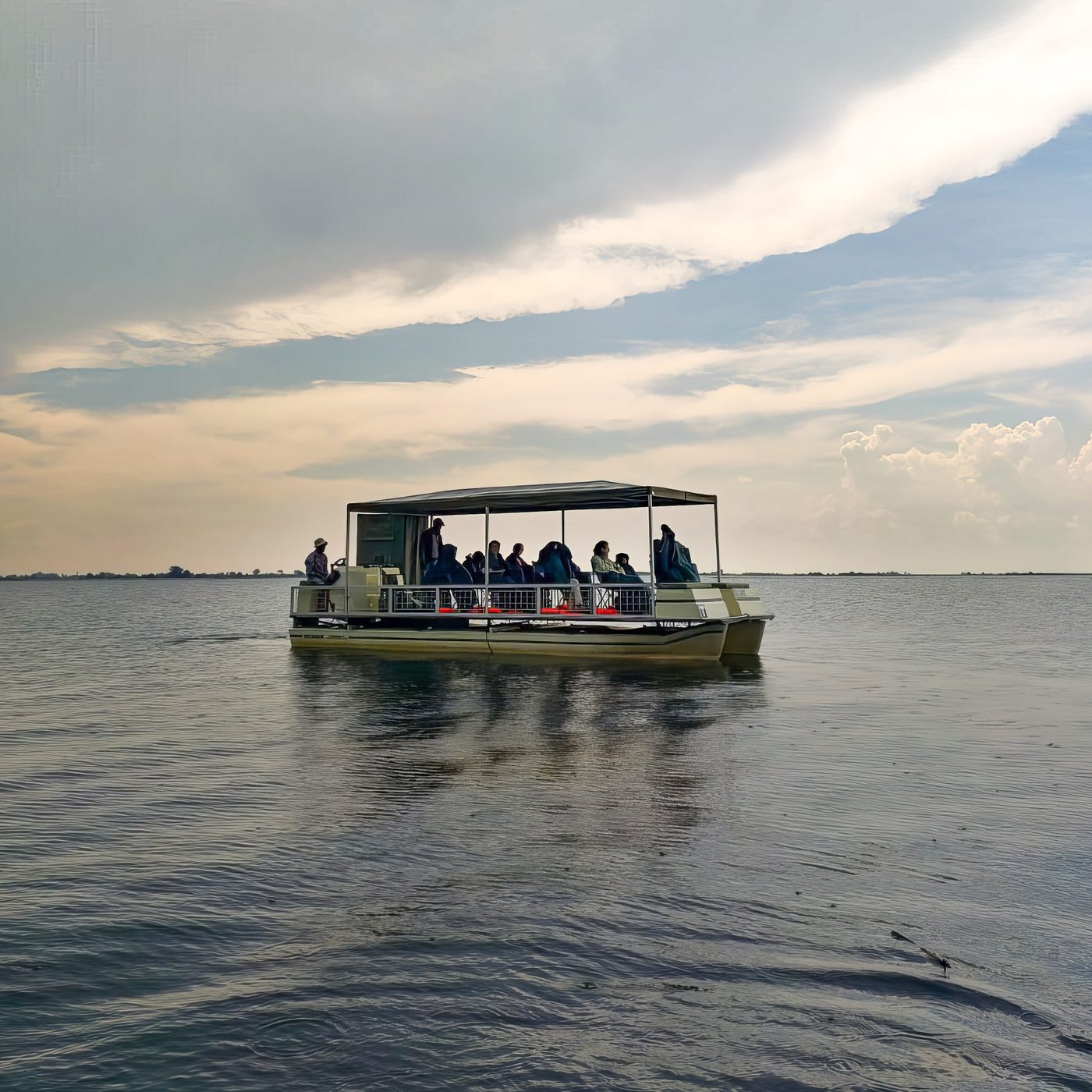 Guests on a river cruise boat near Chobe Elephant Camp