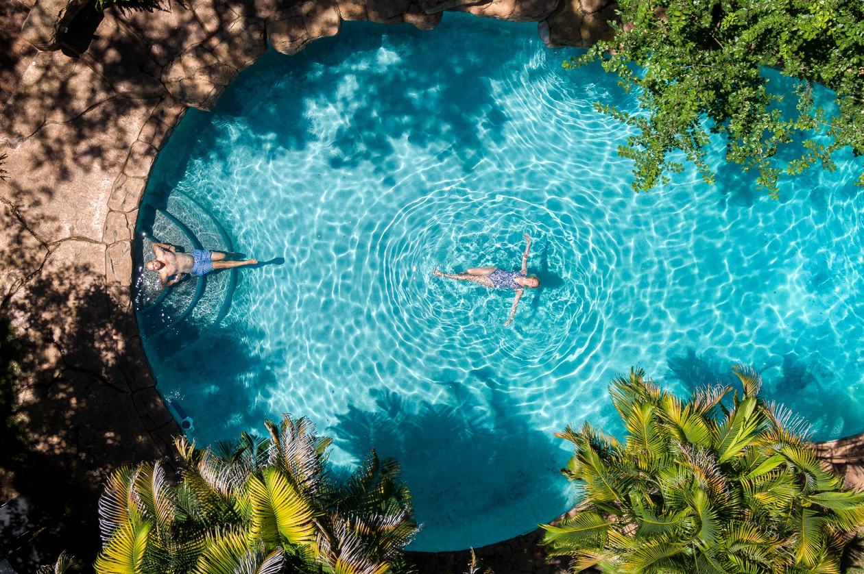 Aerial view of swimmers in the pool at Chobe Game Lodge