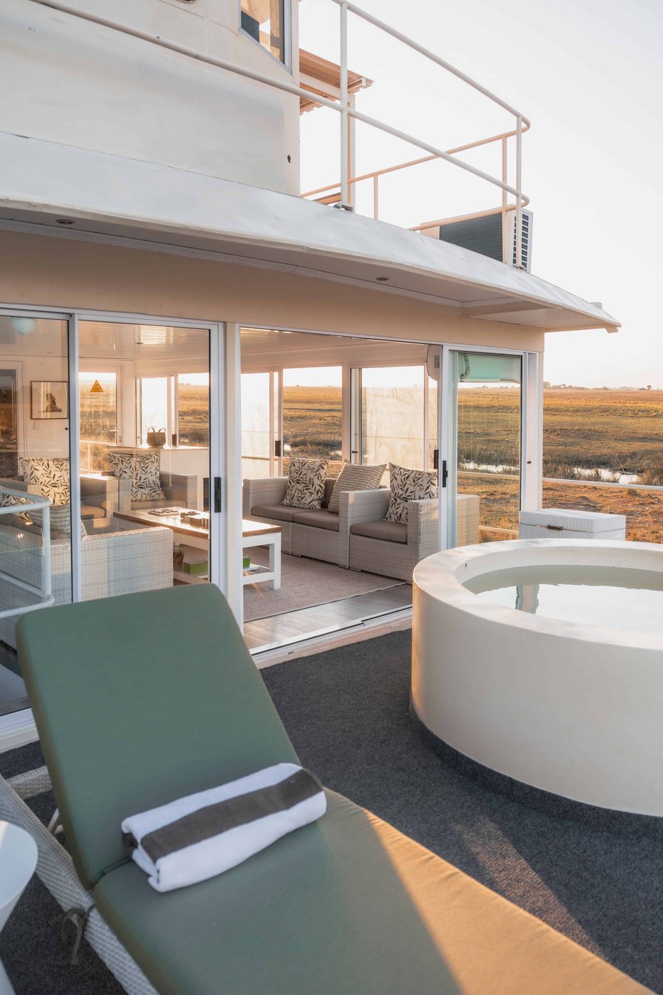 Round soaking tub on the upper deck suite at Chobe Princess