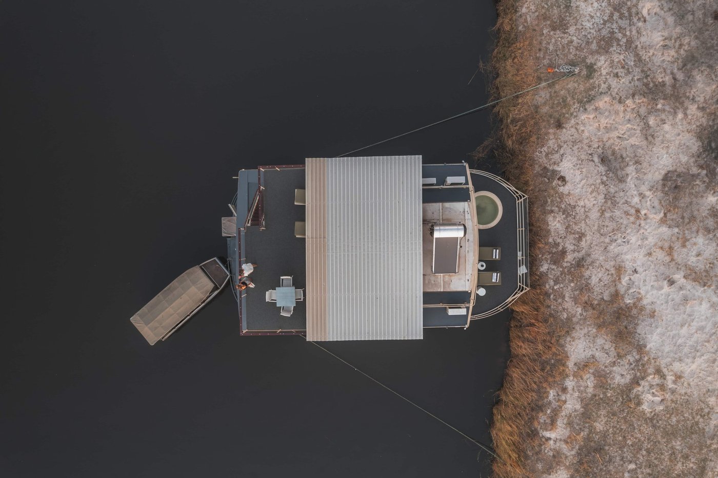 Aerial view of the houseboat moving along the river at Chobe Princess