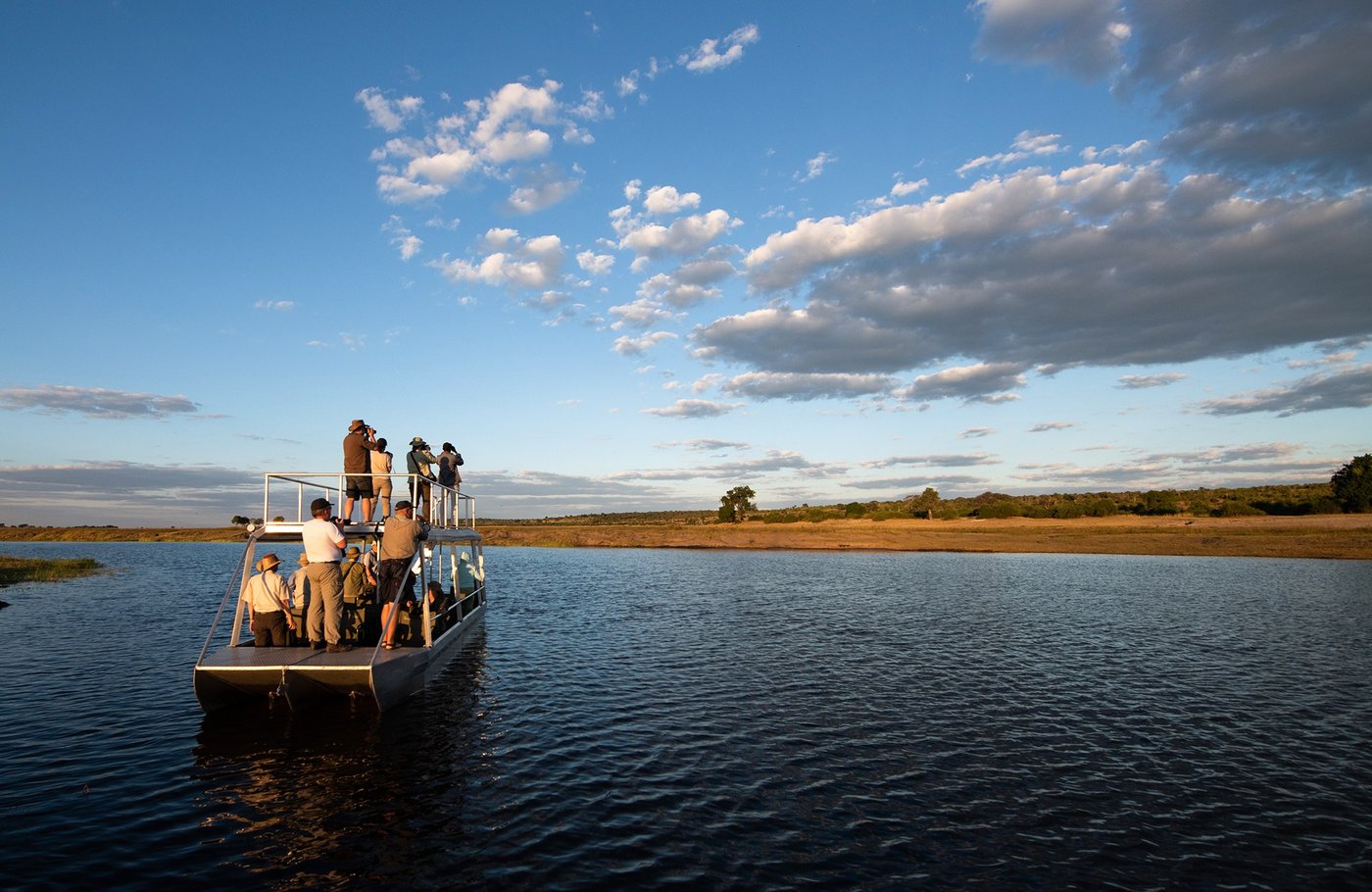 Guests on a river cruise boat near Chobe River Camp