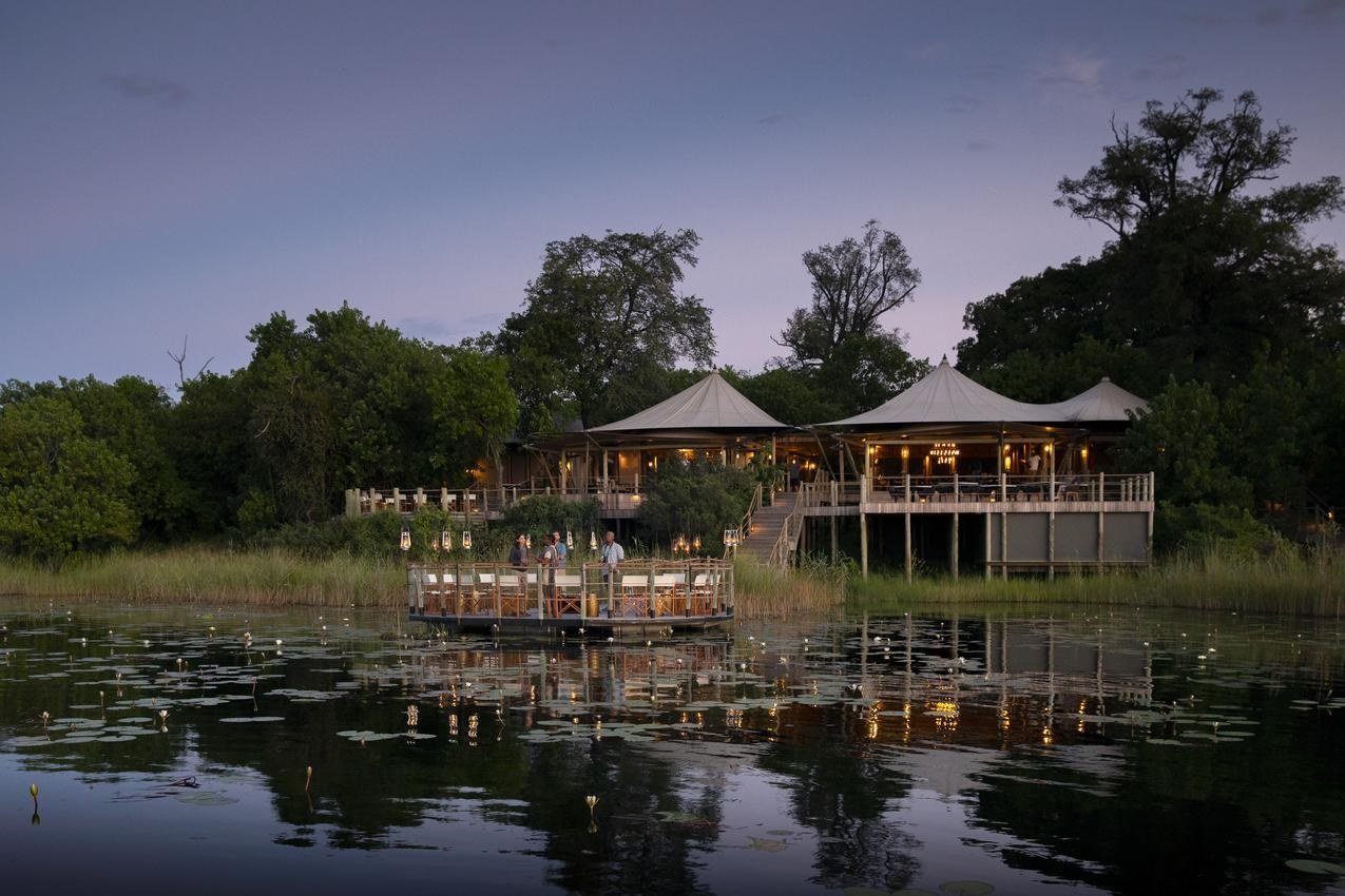 Aerial view of the plunge pool deck at dusk at DumaTau Camp