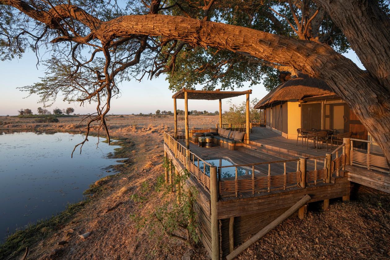 Private tent with its own pool and deck at sunset at King's Pool Camp
