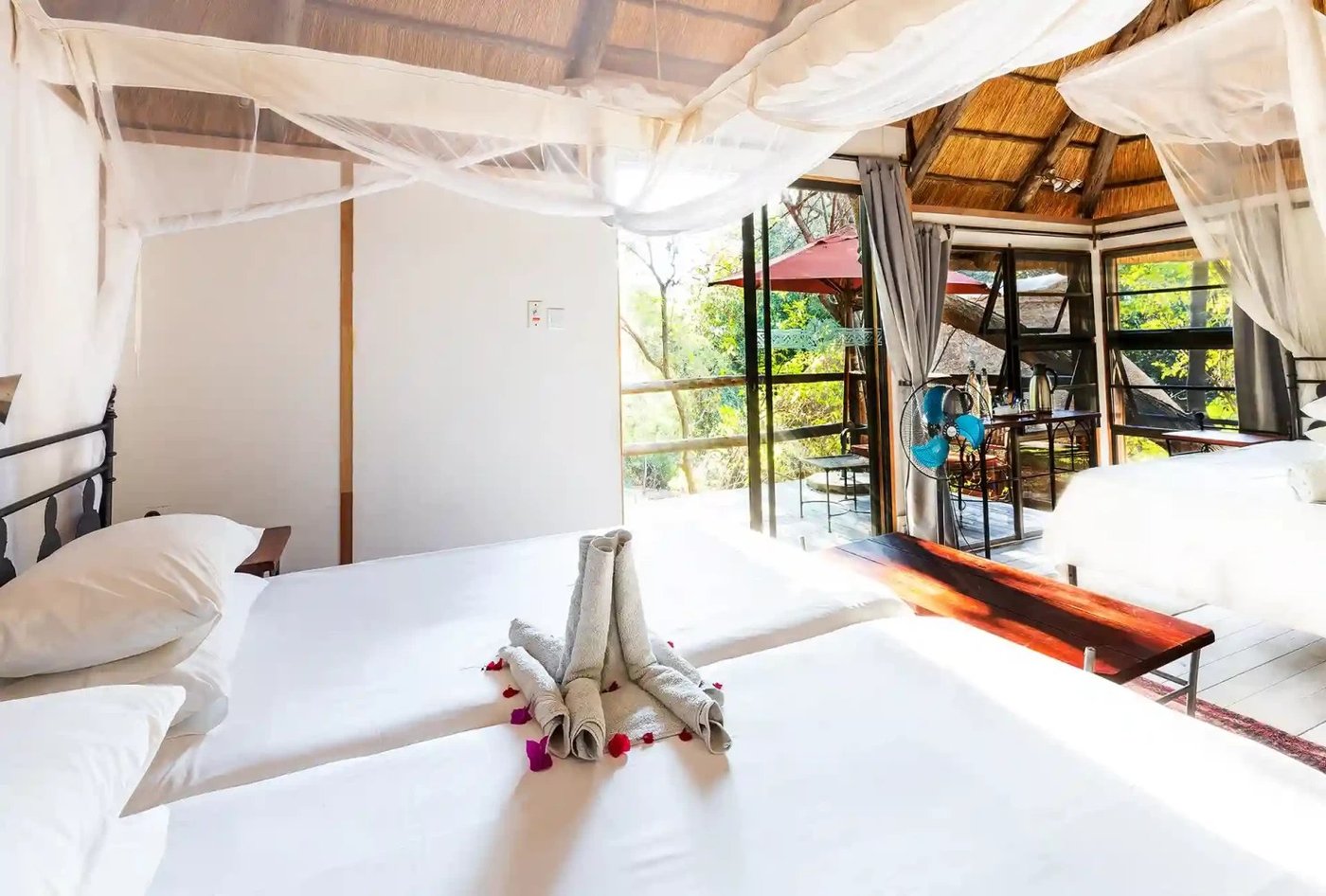 Elephant-shaped towel art on the turned-down bed at Kubu Lodge