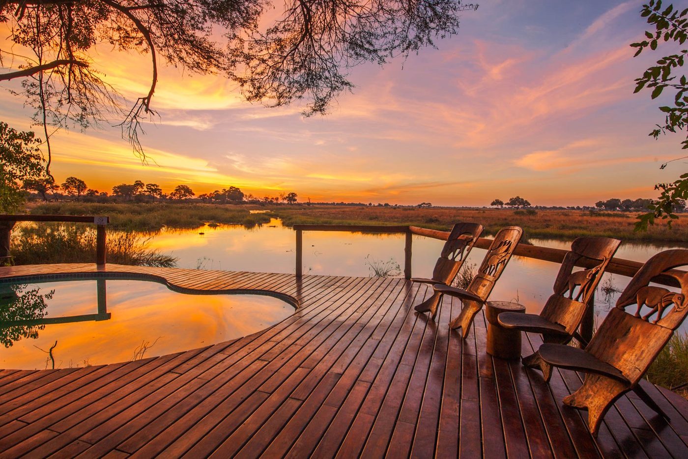 Plunge pool deck with chairs at sunset at Lagoon Camp