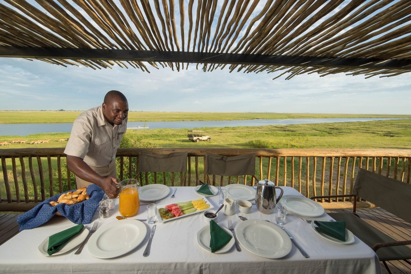 Breakfast served on the deck overlooking the floodplain at Muchenje Safari Lodge