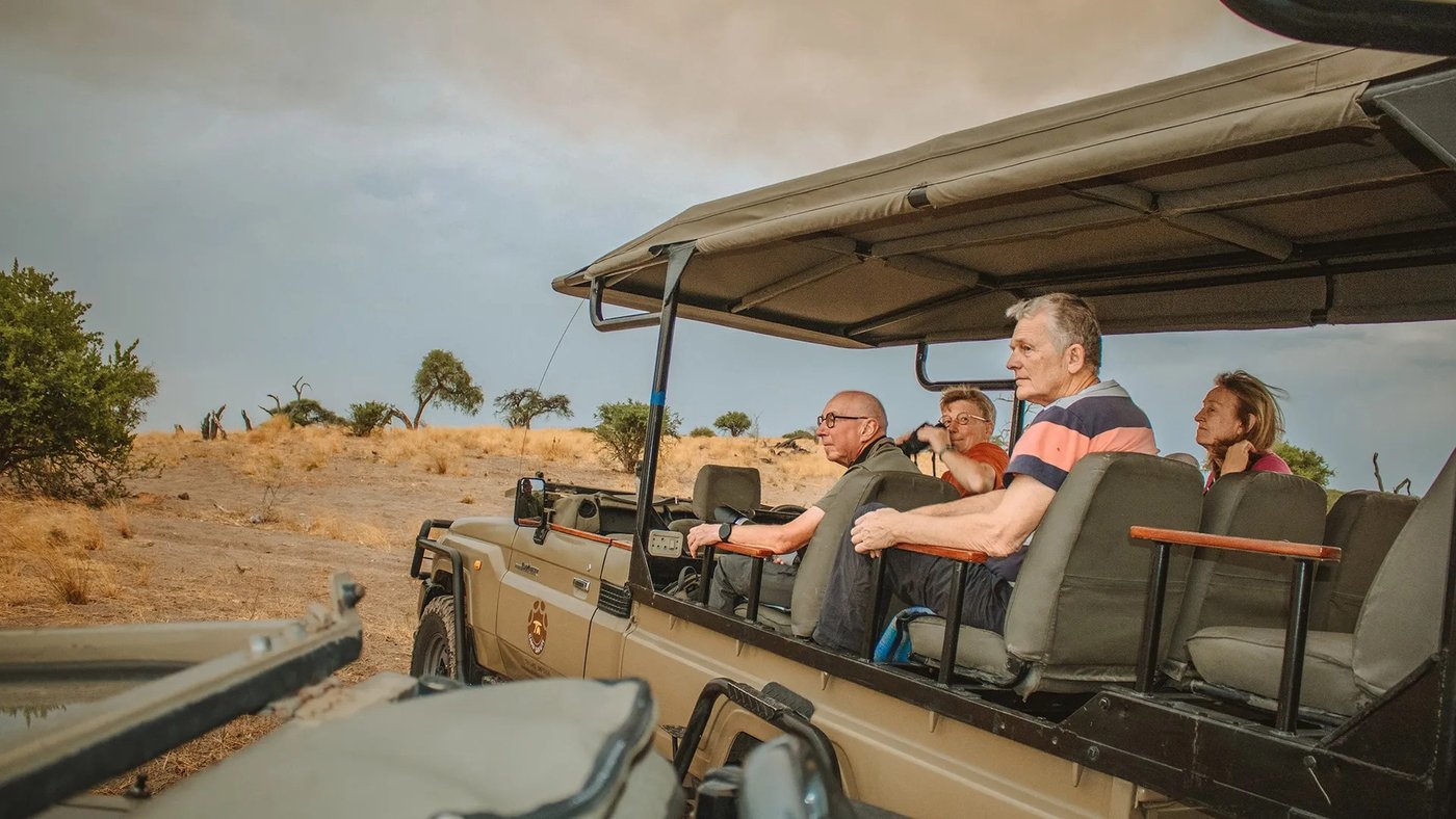 Guests on a game drive vehicle near Savuti Campsite