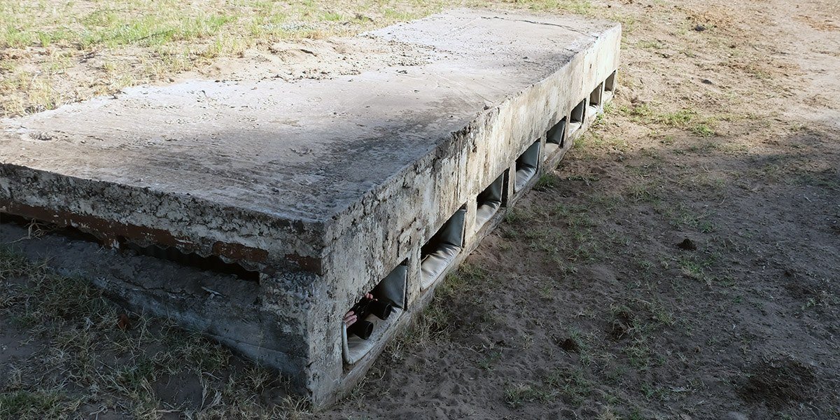Sunken photographic hide overlooking the waterhole at Senyati Safari Camp