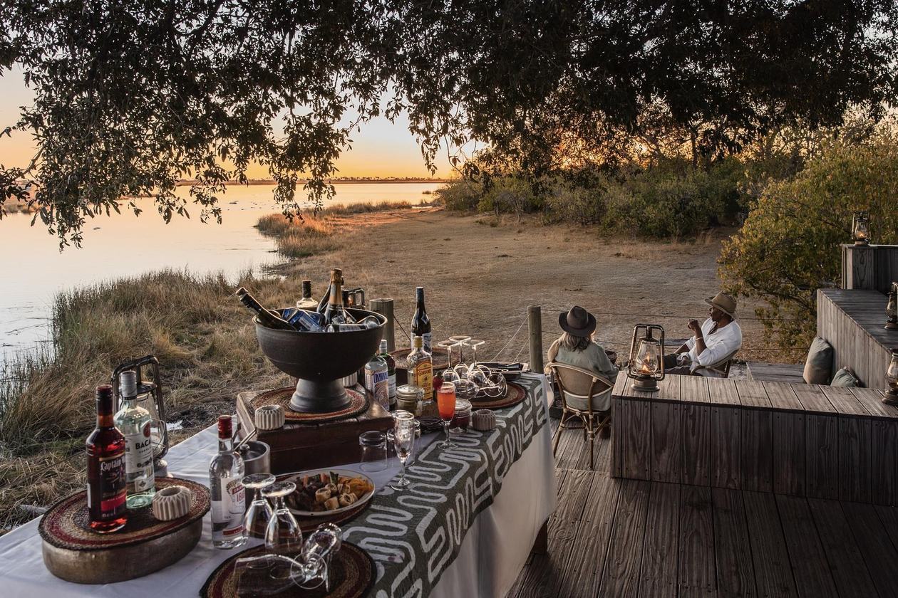 Outdoor bar and dining deck overlooking the river at Wilderness Savuti
