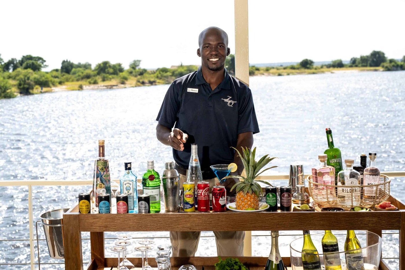 Bartender preparing drinks on the deck at Zambezi Queen